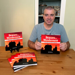 Bob Trapani, Jr. holds his new book "Beacons of Wonderment"